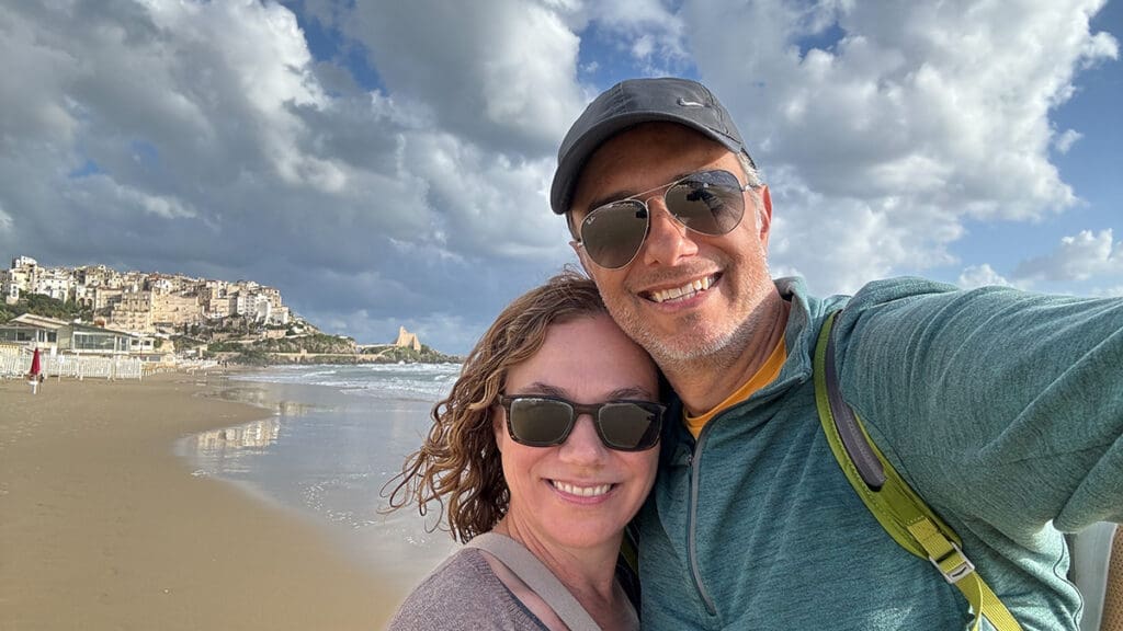 Yvette and Michael, founders of Illustrated Weddings, on a beach in Italy
