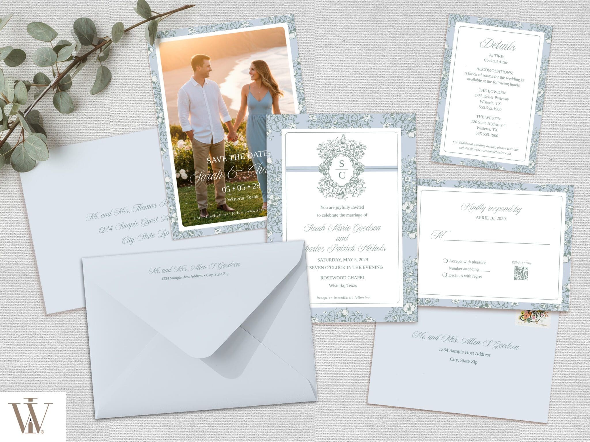 Vintage Blooms wedding suite flat lay with invitation, save the date with photo, RSVP, details card, envelopes, and eucalyptus on linen background